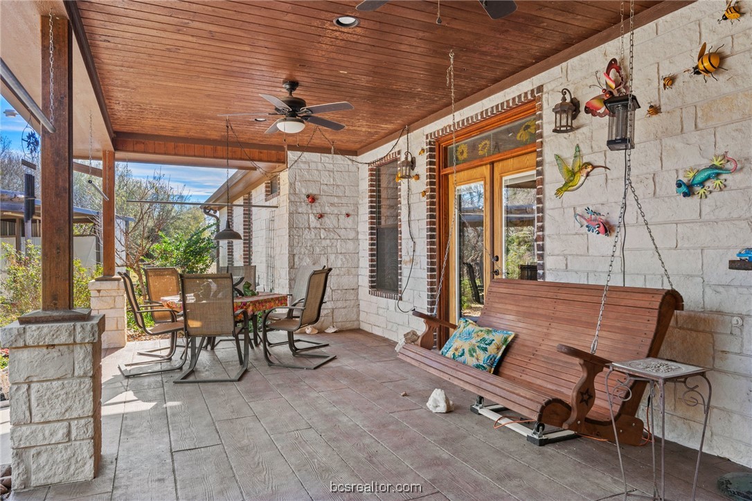 7754 Edge Cut Off Road Hearne, TX 77859 - Photo 31 of 49 a view of a patio with a table and chairs