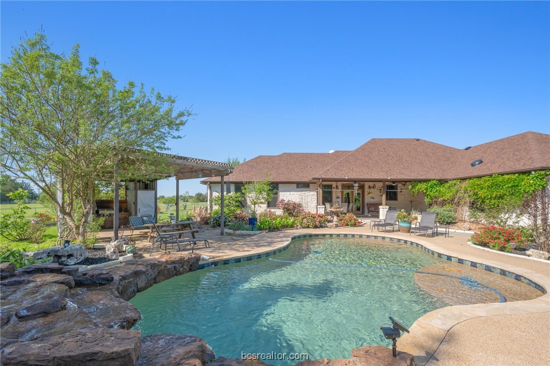 7754 Edge Cut Off Road Hearne, TX 77859 - Photo 32 of 49 Pool featuring a patio area and a pergola