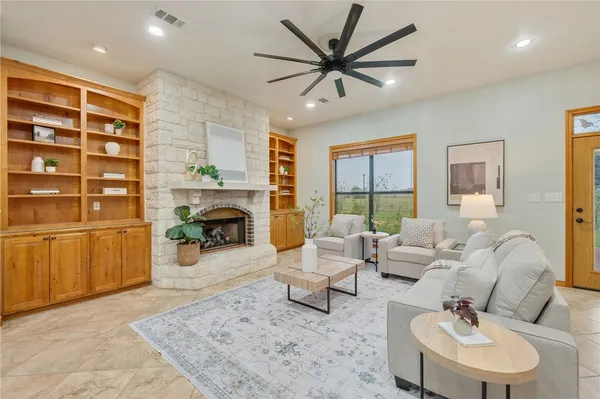 a living room with furniture and a large window