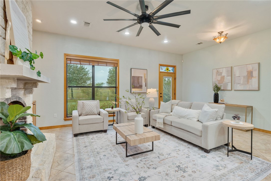 7754 Edge Cut Off Road Hearne, TX 77859 - Photo 6 of 49 a living room with furniture and a large window