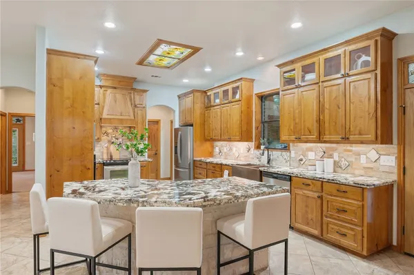 a kitchen with counter top space and appliances