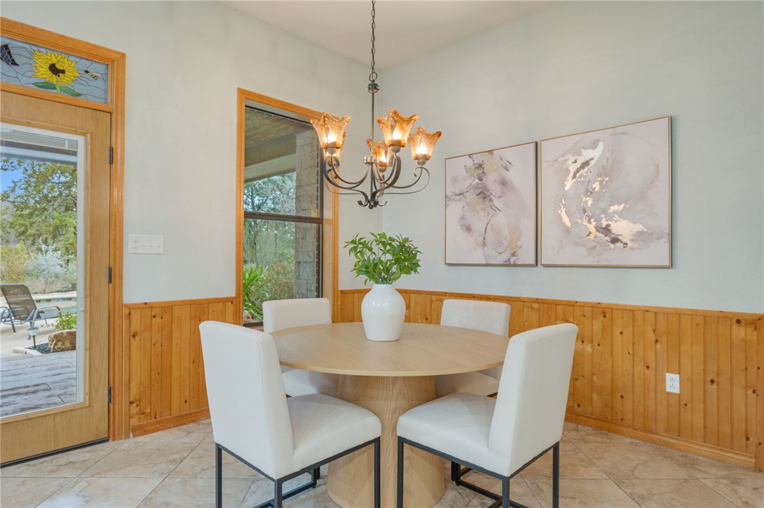 7754 Edge Cut Off Road Hearne, TX 77859 - Photo 10 of 49 a dining room with furniture potted plants and wooden floor