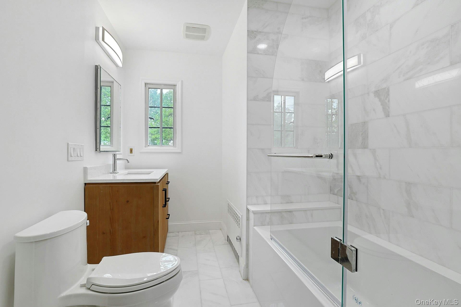 14 Withington Road Scarsdale, NY 10583 - Photo 26 of 41 a bathroom with a sink a toilet and shower