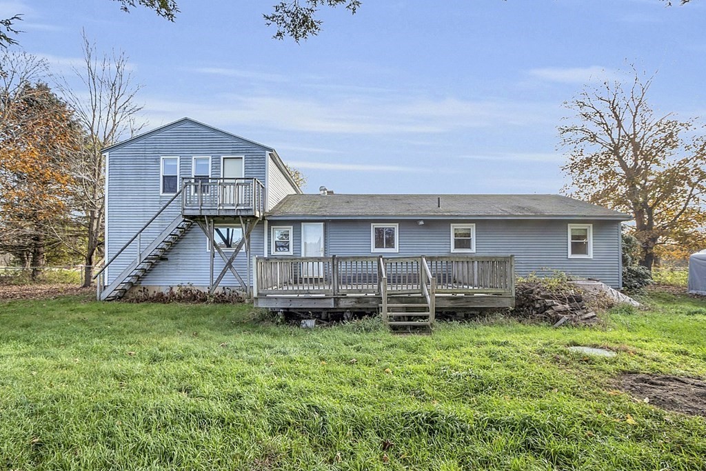 320 Bolton Road Lancaster, MA 01523 - Photo 1 of 28 a view of a house with a yard and a large tree