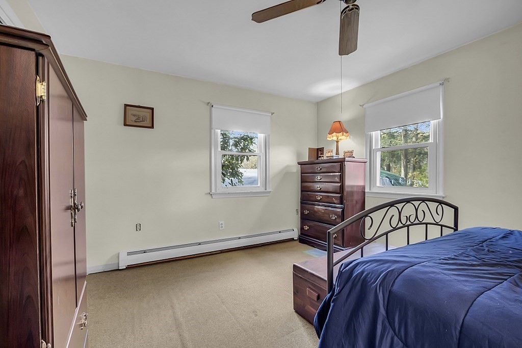 320 Bolton Road Lancaster, MA 01523 - Photo 13 of 28 a bedroom with furniture and window