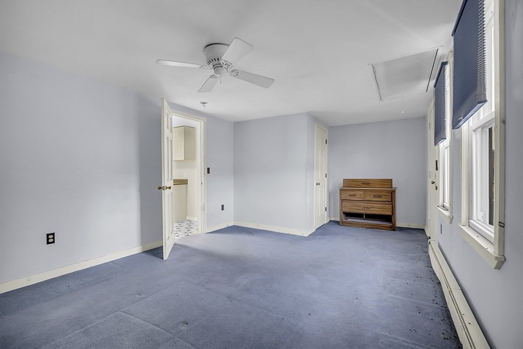 320 Bolton Road Lancaster, MA 01523 - Photo 7 of 28 a view of an empty room with a window