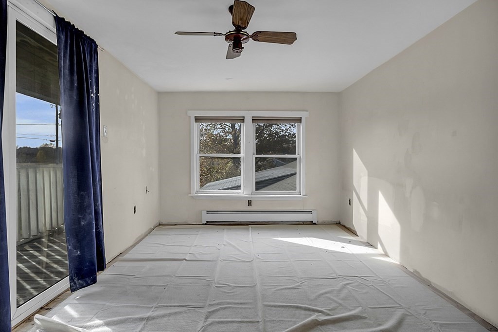 320 Bolton Road Lancaster, MA 01523 - Photo 8 of 28 a view of an empty room with a window