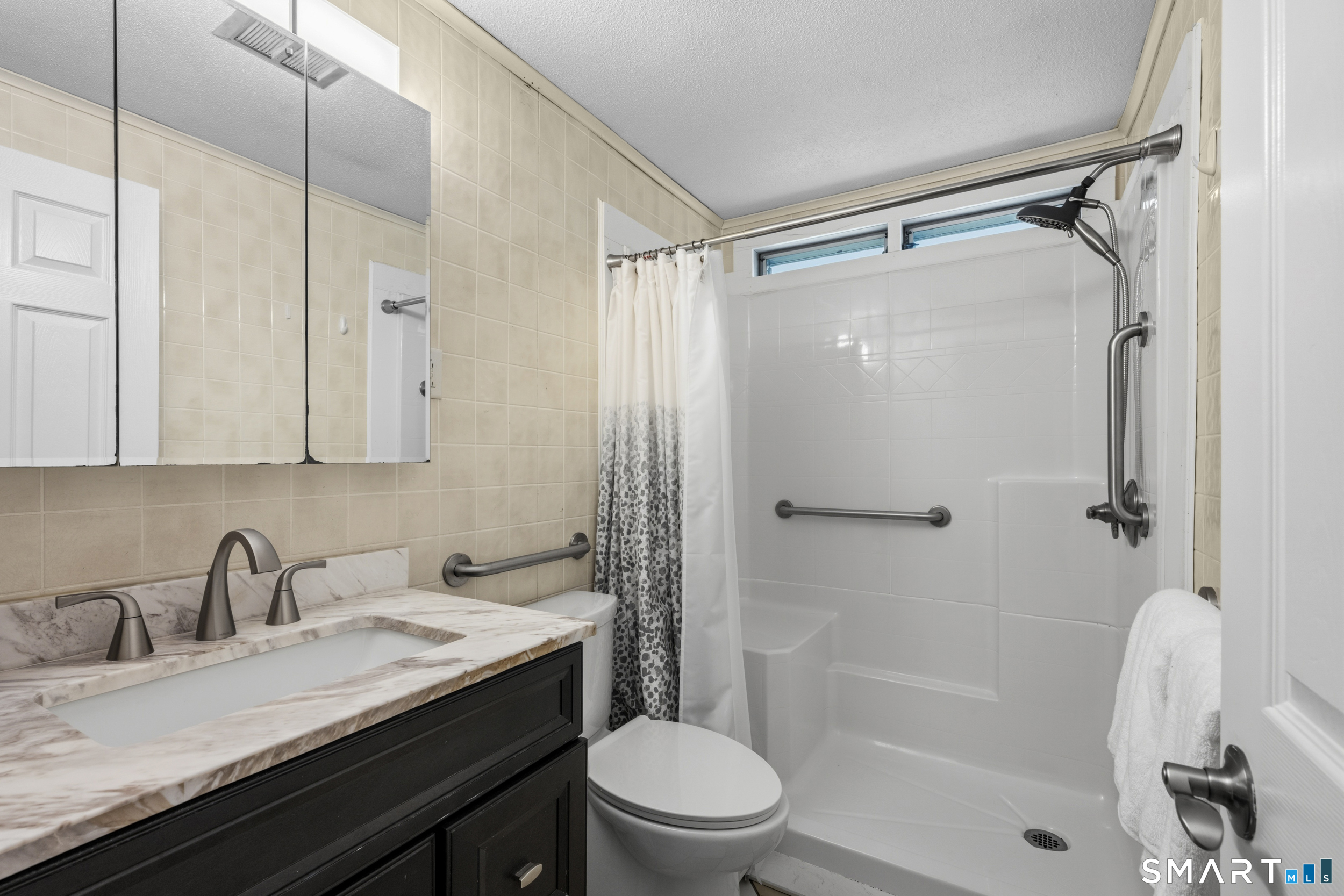 90 Sturtevant Street Norwich, CT 06360 - Photo 17 of 40 Full hallway bath with grab bars and walk in shower