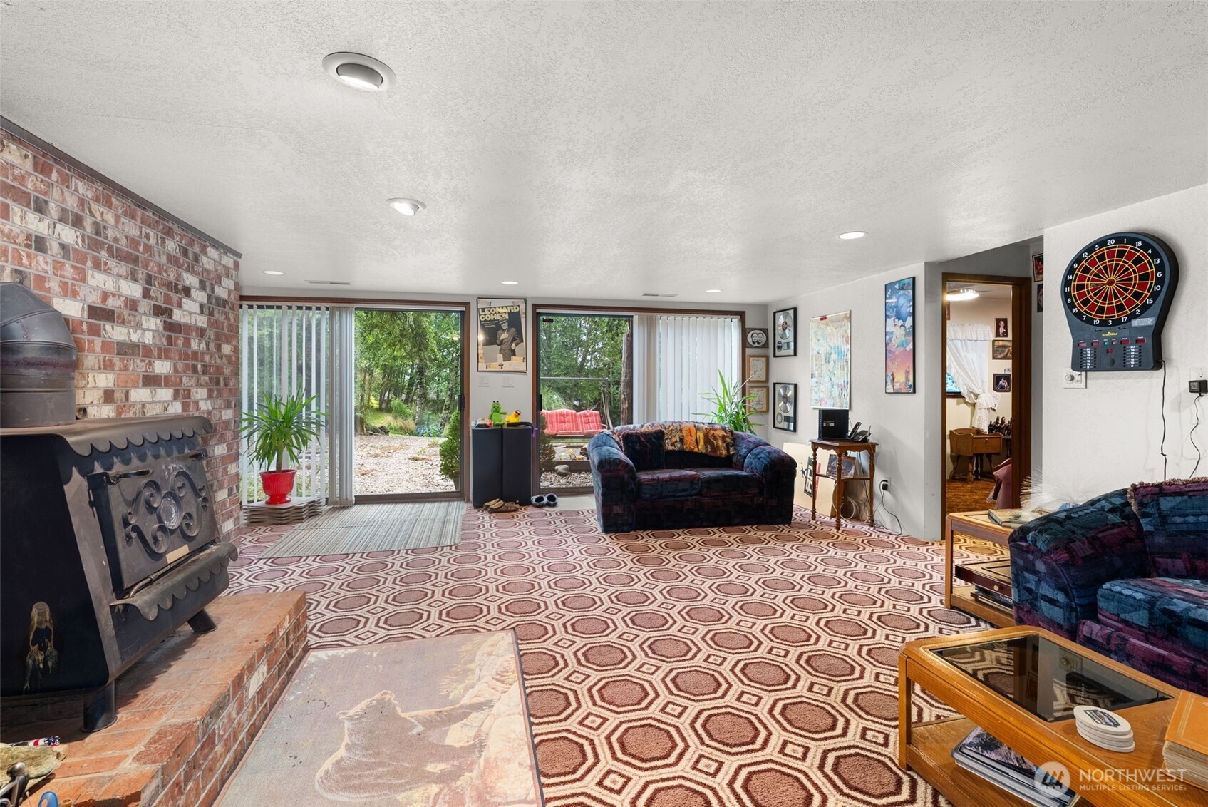 43 Hines Valley Road Raymond, WA 98577 - Photo 24 of 40 a living room with furniture fireplace and a flat screen tv