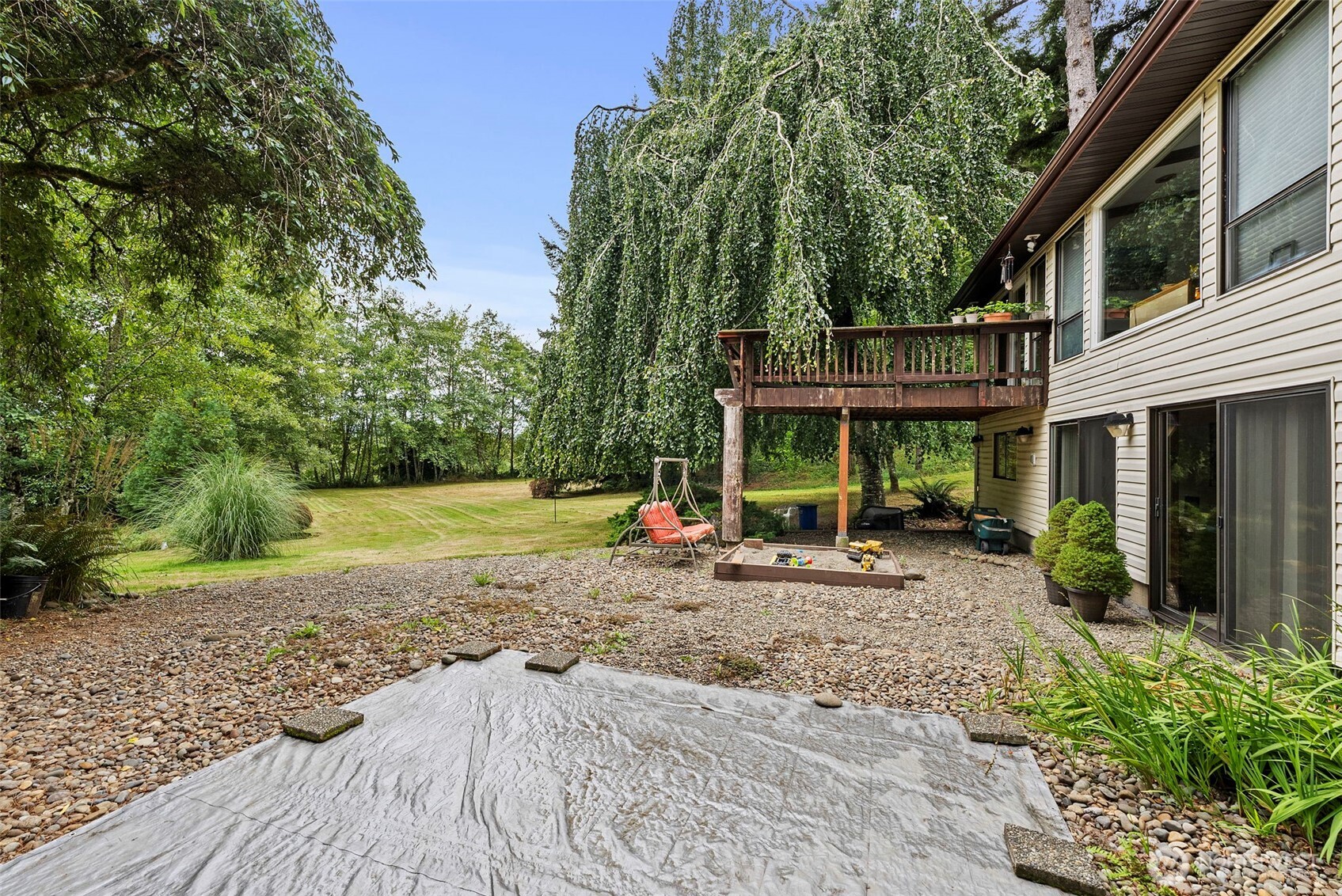 43 Hines Valley Road Raymond, WA 98577 - Photo 32 of 40 a view of a house with backyard porch and sitting area