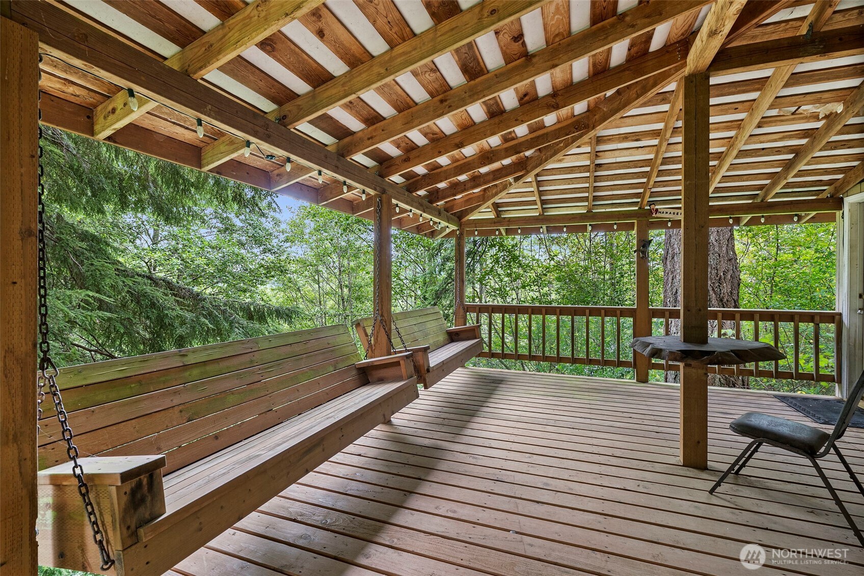 43 Hines Valley Road Raymond, WA 98577 - Photo 7 of 40 a view of a room with wooden floor and outdoor space