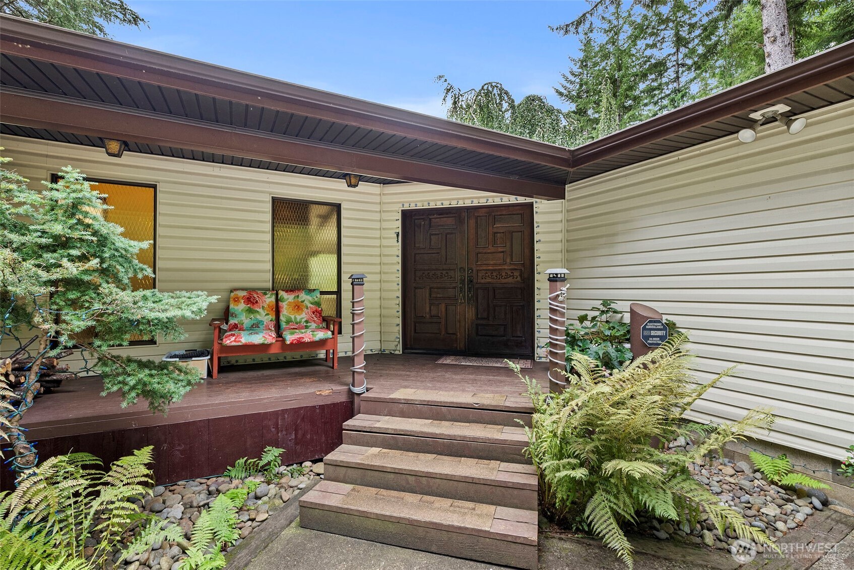 43 Hines Valley Road Raymond, WA 98577 - Photo 8 of 40 a view of a house with chairs and flower plants
