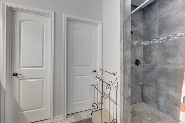 a bathroom with a glass shower door