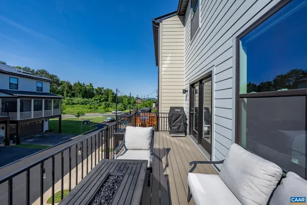 a view of balcony with furniture