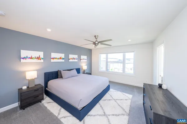 a bedroom with a bed and a table in it