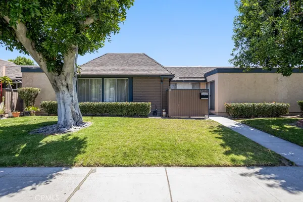 front view of a house with a yard