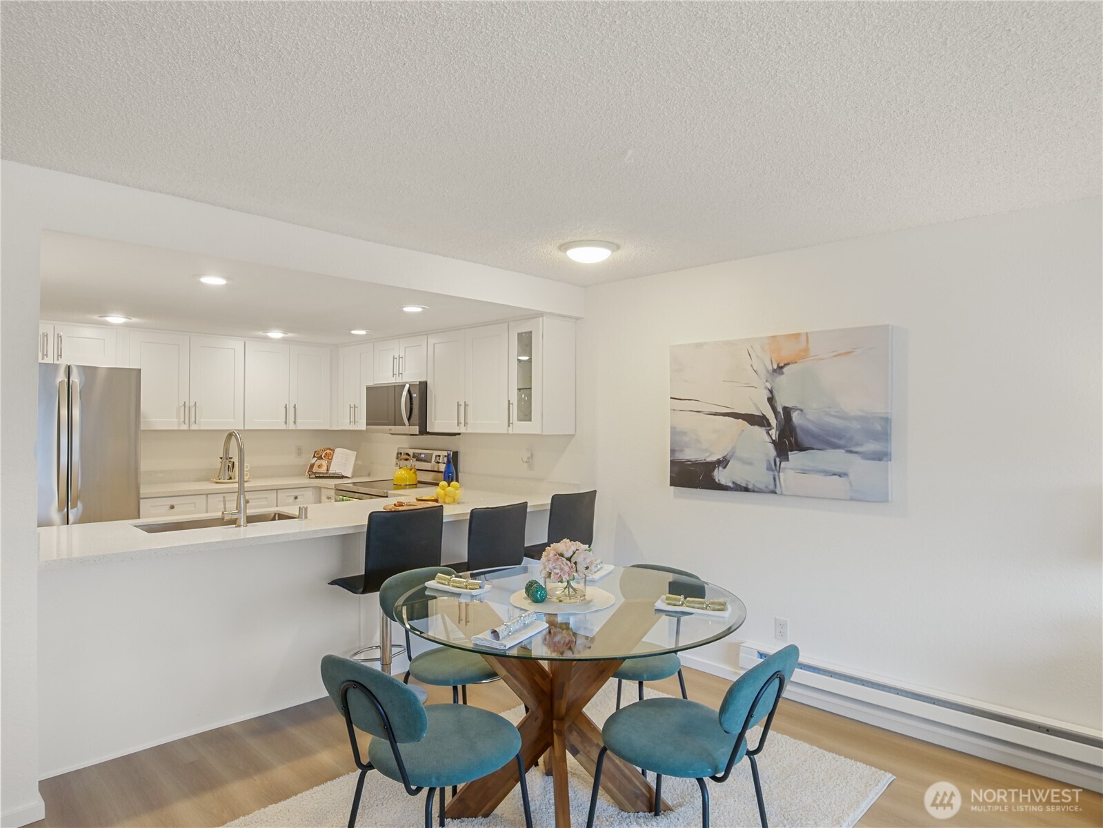 30853 13th Place South, Unit 2 Federal Way, WA 98003 - Photo 11 of 37 a view of a dining room with furniture and a potted plant