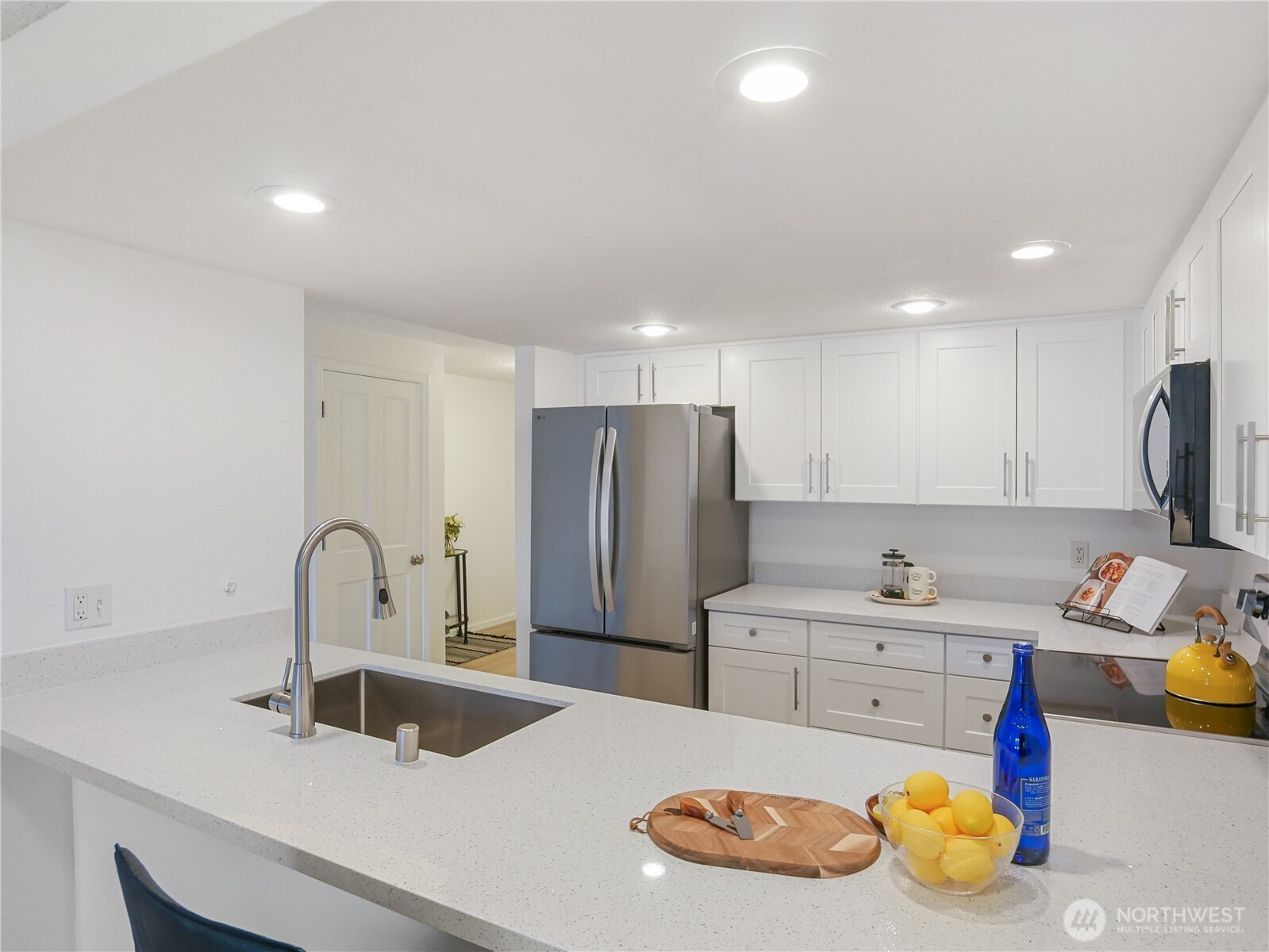 30853 13th Place South, Unit 2 Federal Way, WA 98003 - Photo 14 of 37 a kitchen with refrigerator and cabinets