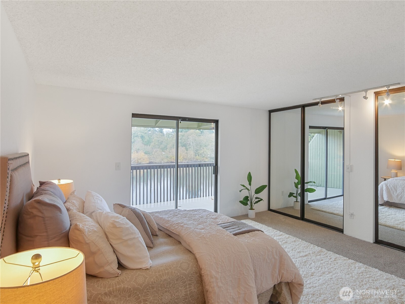 30853 13th Place South, Unit 2 Federal Way, WA 98003 - Photo 17 of 37 a bedroom with a bed and a large window