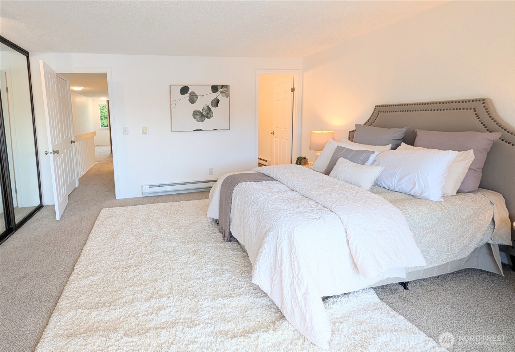 30853 13th Place South, Unit 2 Federal Way, WA 98003 - Photo 19 of 37 a bedroom with a bed and painting on the wall