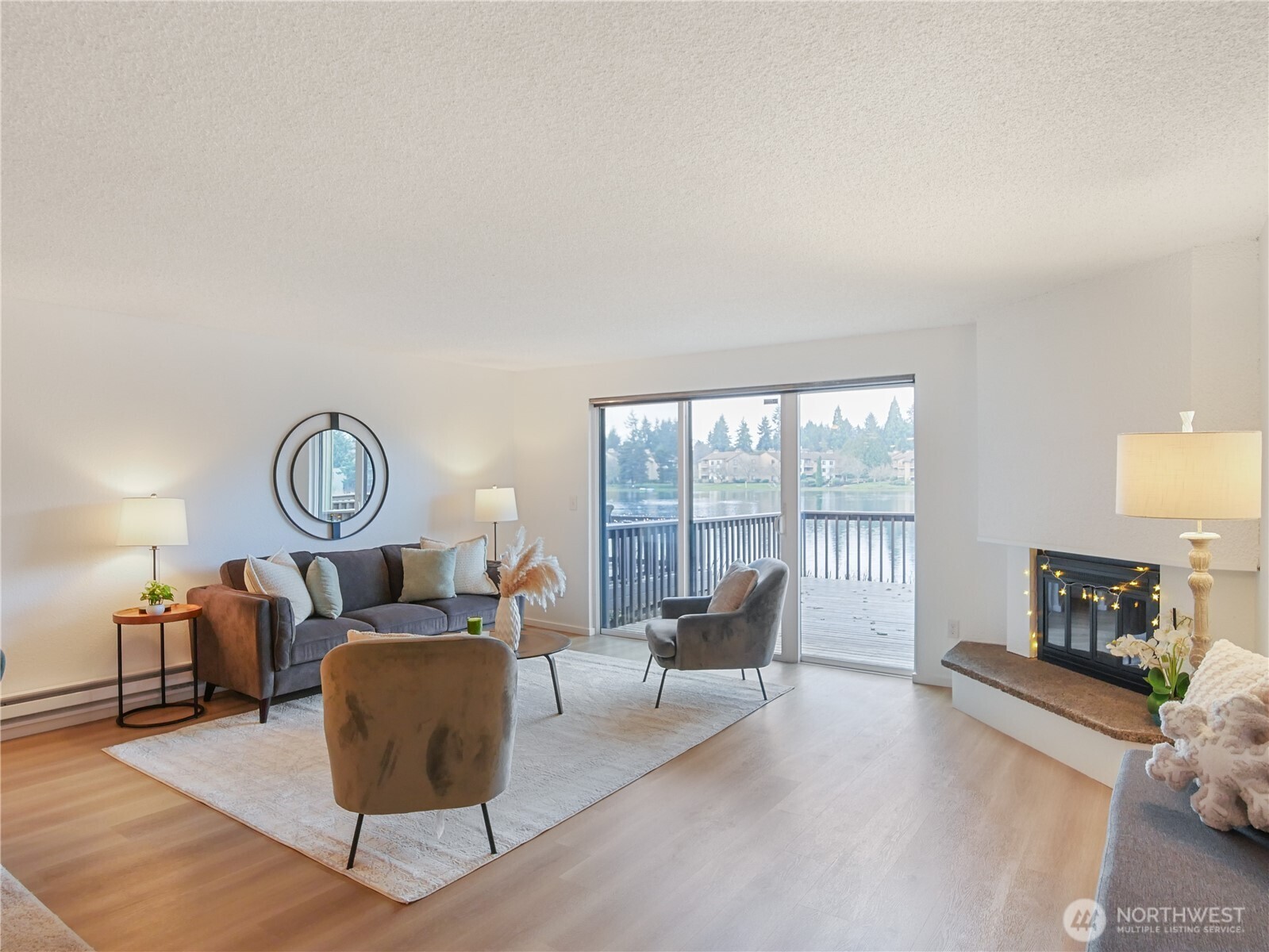 30853 13th Place South, Unit 2 Federal Way, WA 98003 - Photo 2 of 37 a living room with furniture a rug and a fireplace