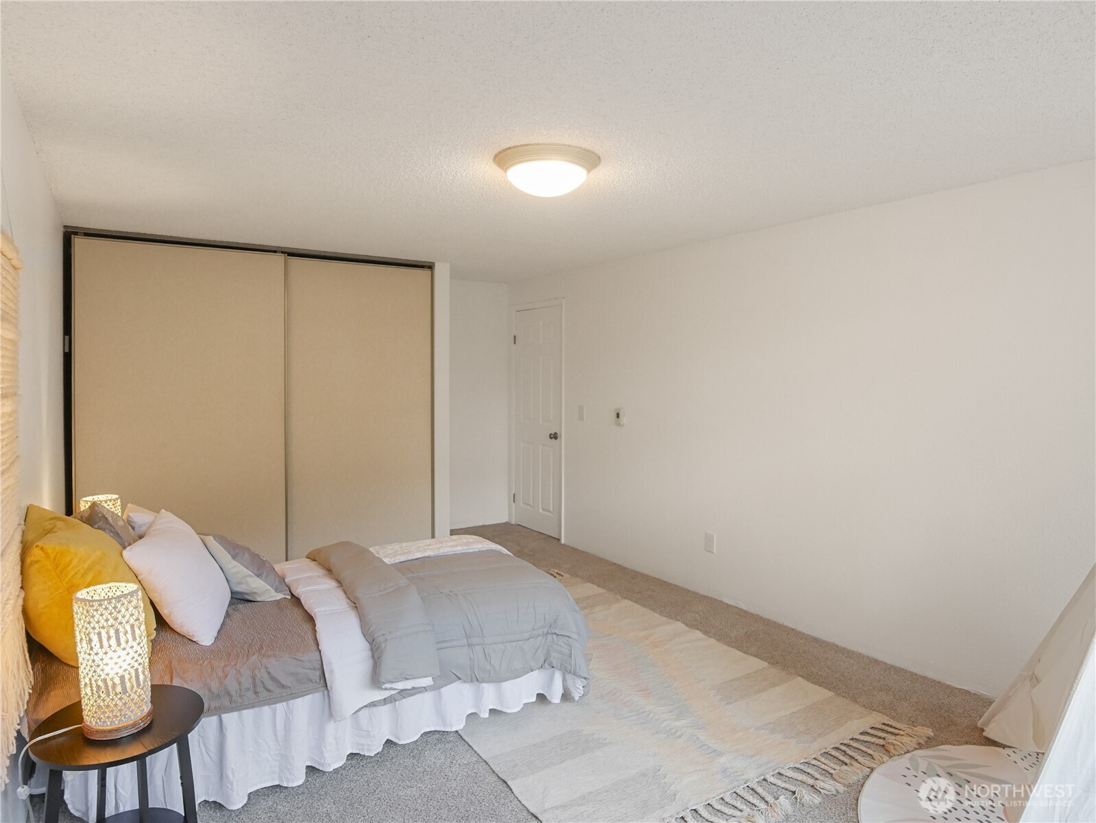 30853 13th Place South, Unit 2 Federal Way, WA 98003 - Photo 23 of 37 a bedroom with a bed and chair