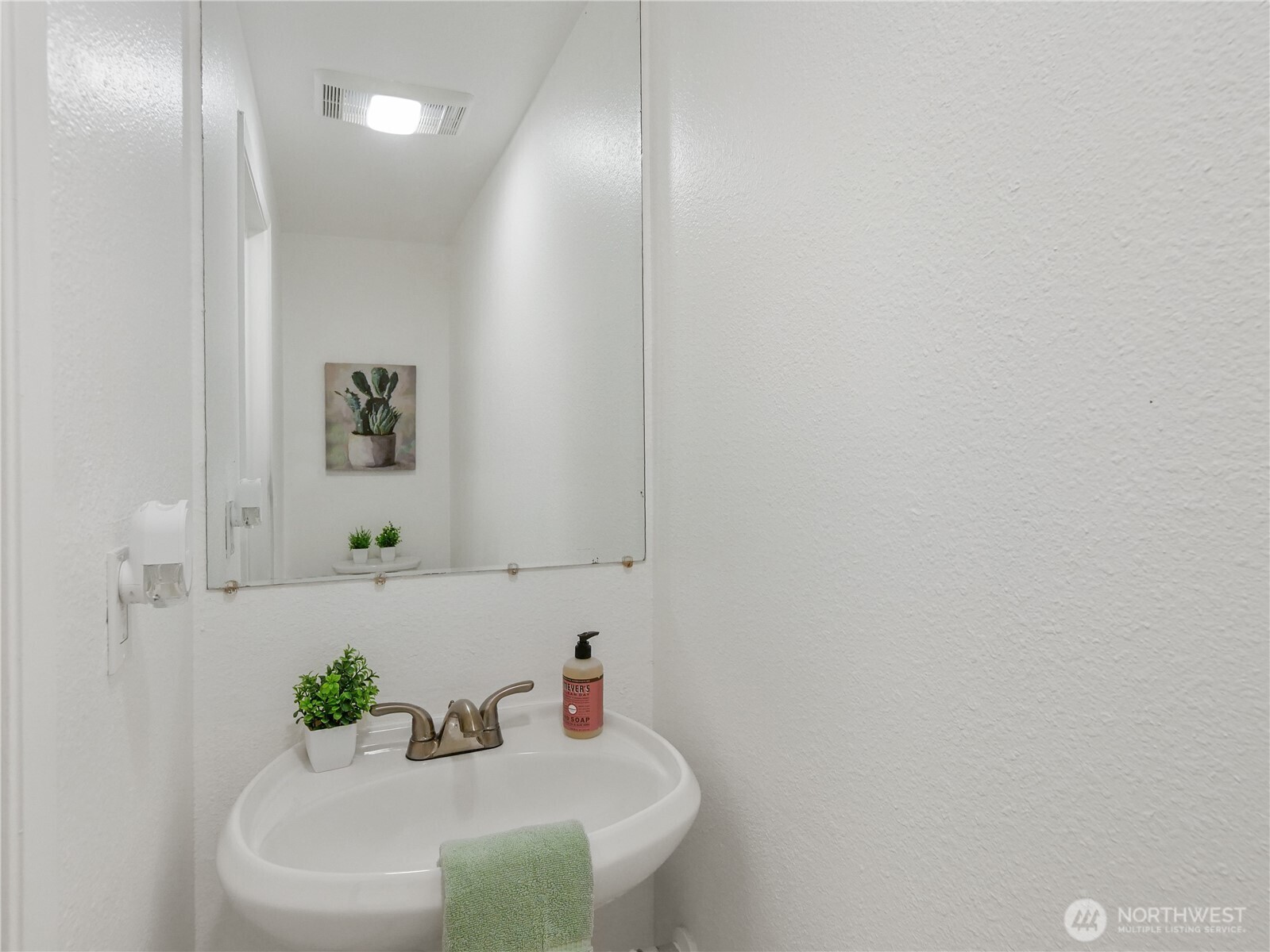 30853 13th Place South, Unit 2 Federal Way, WA 98003 - Photo 28 of 37 a bathroom with a sink and a mirror