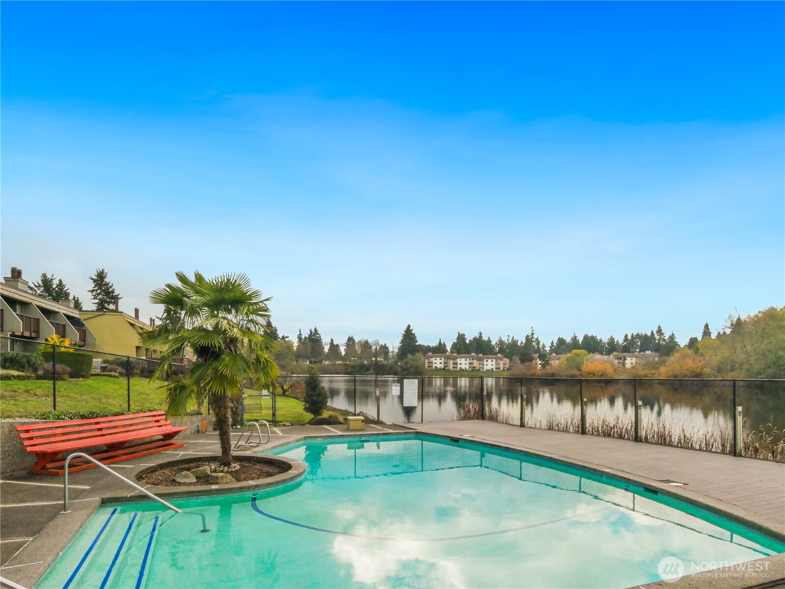 30853 13th Place South, Unit 2 Federal Way, WA 98003 - Photo 34 of 37 a view of a lake with couches in the patio