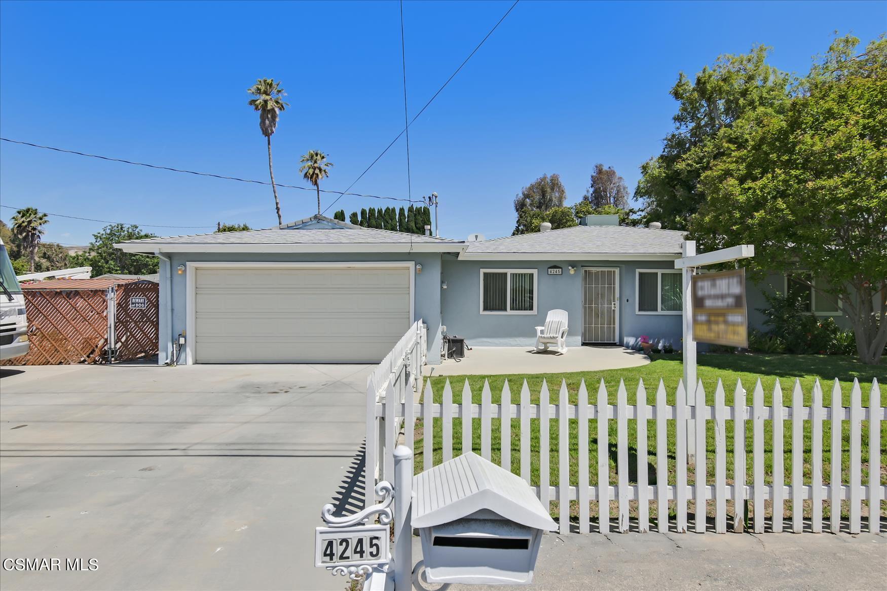 4245 Adam Road Simi Valley, CA 93063 - Photo 1 of 20 a front view of a house with a garden