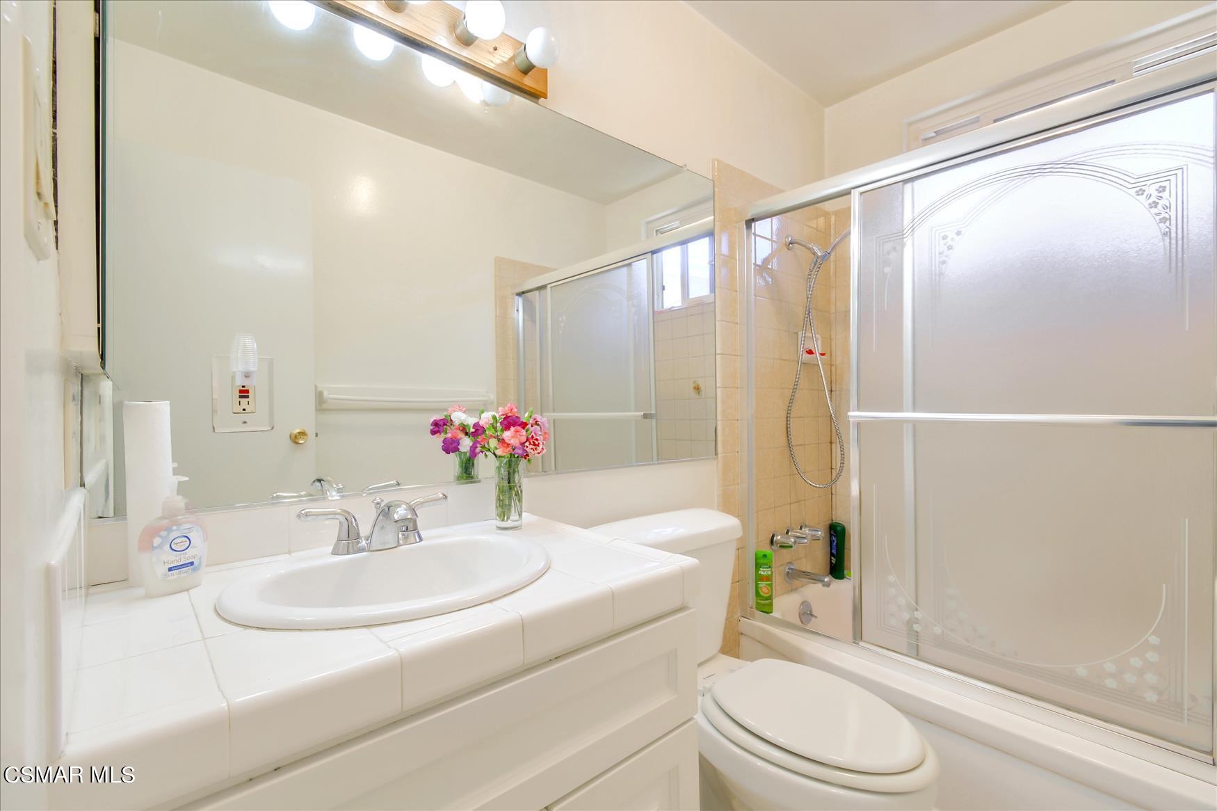 4245 Adam Road Simi Valley, CA 93063 - Photo 13 of 20 a bathroom with a sink toilet and shower