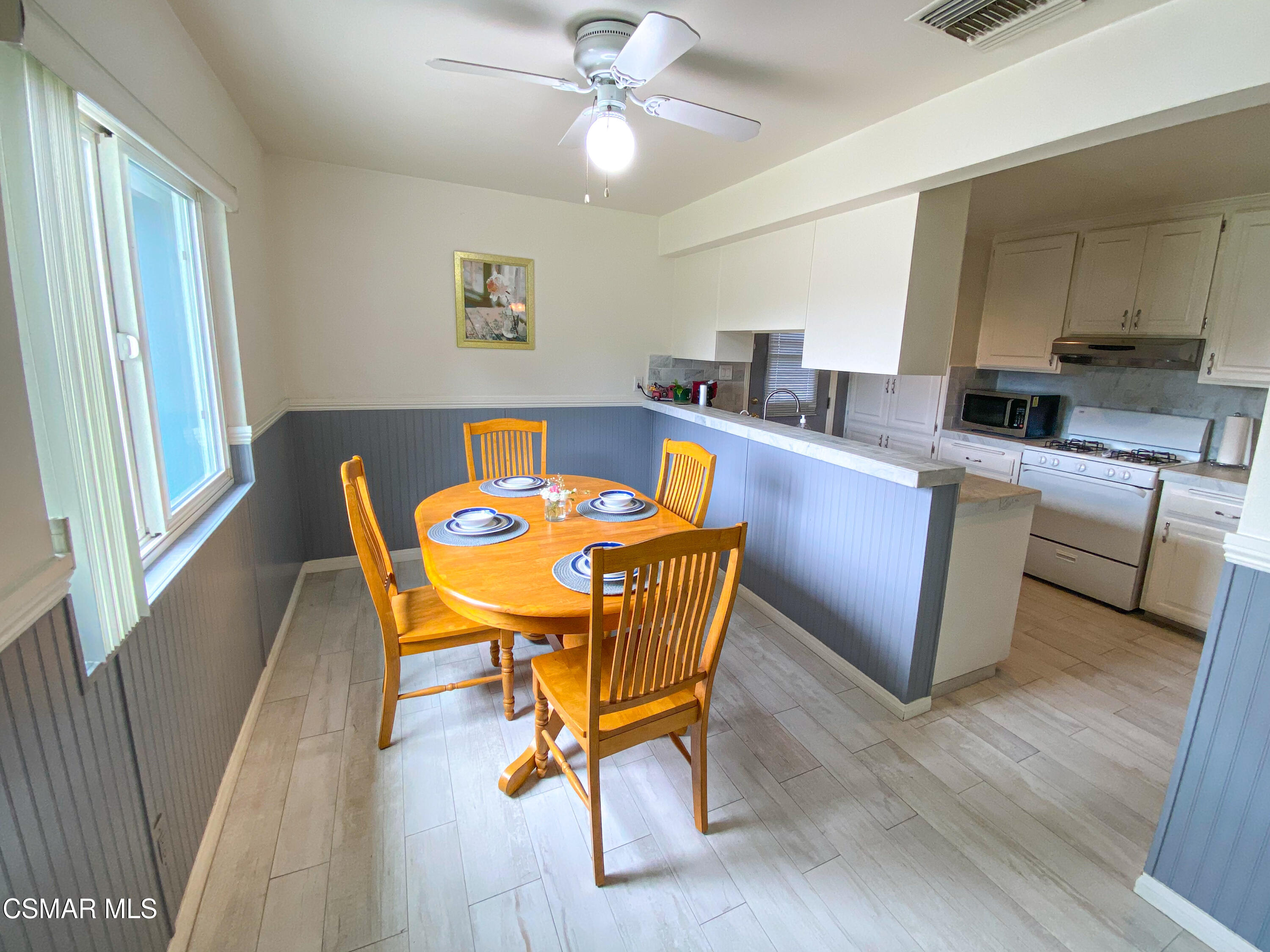 4245 Adam Road Simi Valley, CA 93063 - Photo 6 of 20 a dining room with furniture and wooden floor