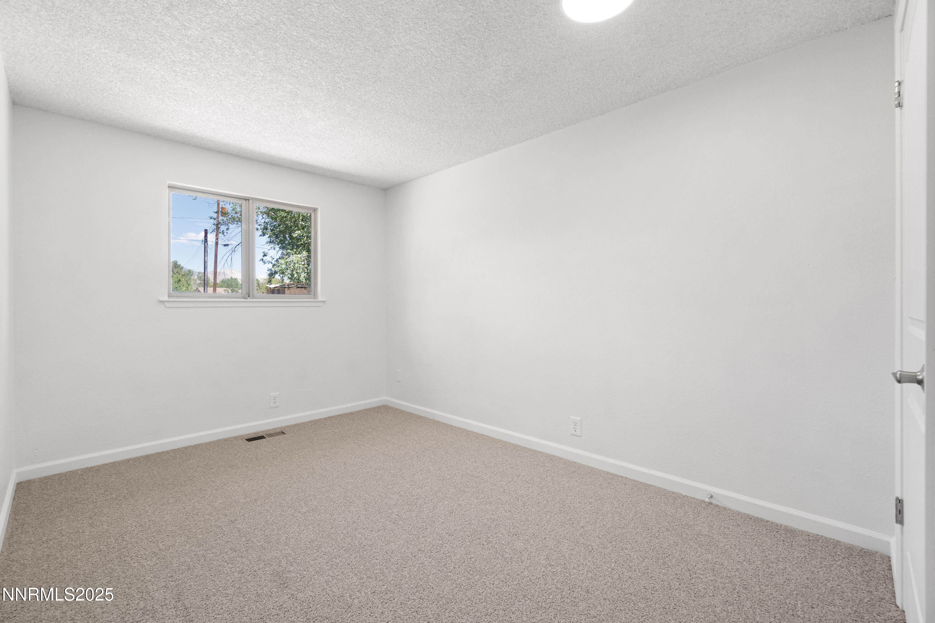 129 Ring Road Dayton, NV 89403 - Photo 17 of 27 an empty room with a window