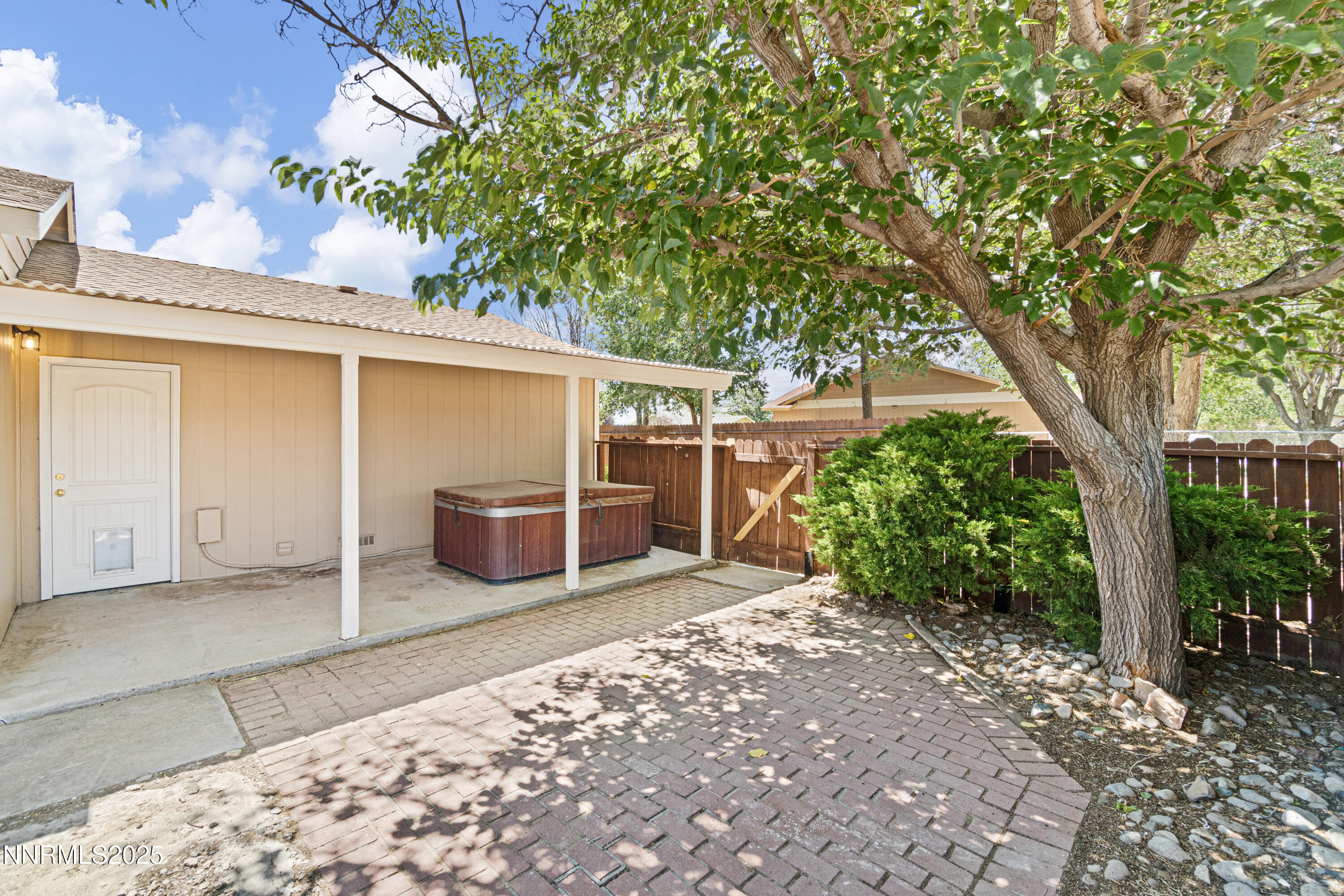 129 Ring Road Dayton, NV 89403 - Photo 23 of 27 a view of a backyard with plants and large tree