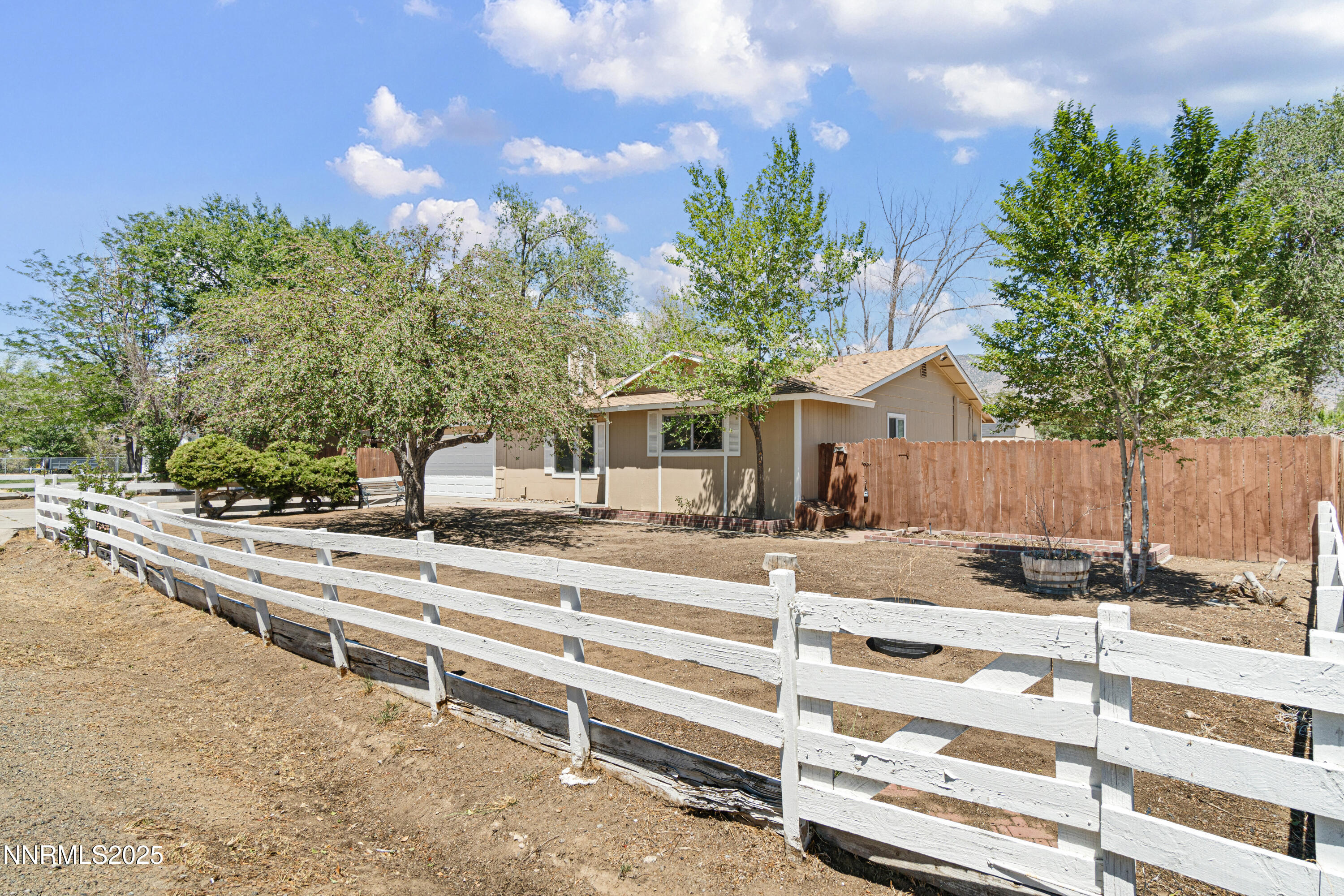 129 Ring Road Dayton, NV 89403 - Photo 3 of 27 a view of a house with backyard and trees