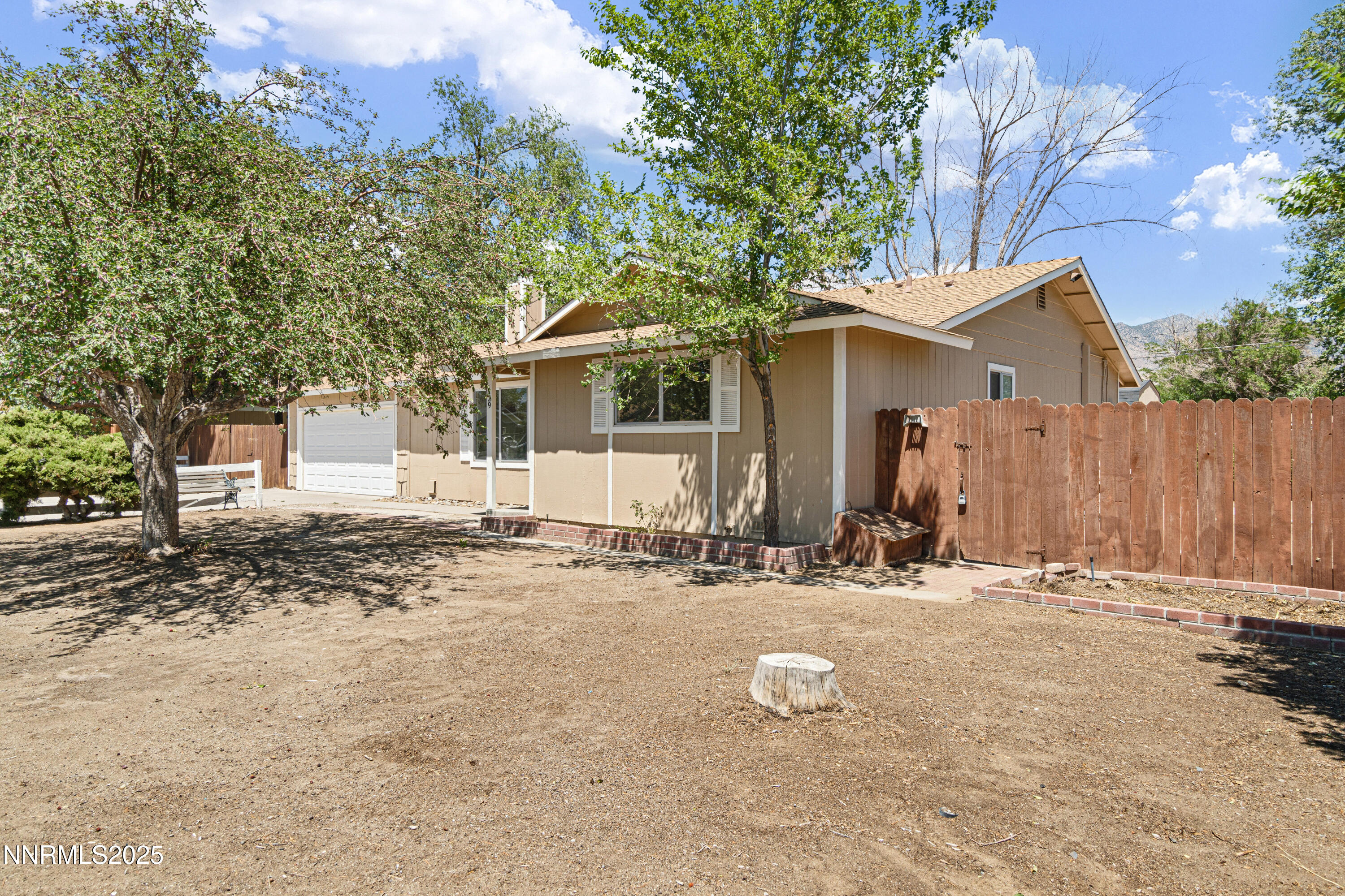 129 Ring Road Dayton, NV 89403 - Photo 5 of 27 a view of a house with a yard