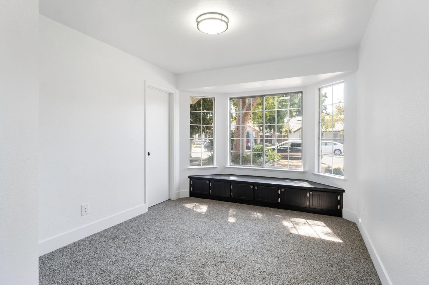 2481 Gibson Avenue Clovis, CA 93611 - Photo 19 of 24 an empty room with large windows