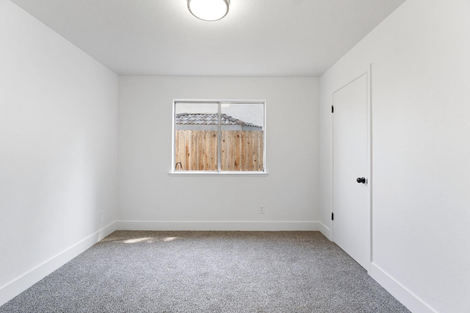 2481 Gibson Avenue Clovis, CA 93611 - Photo 20 of 24 an empty room with a window