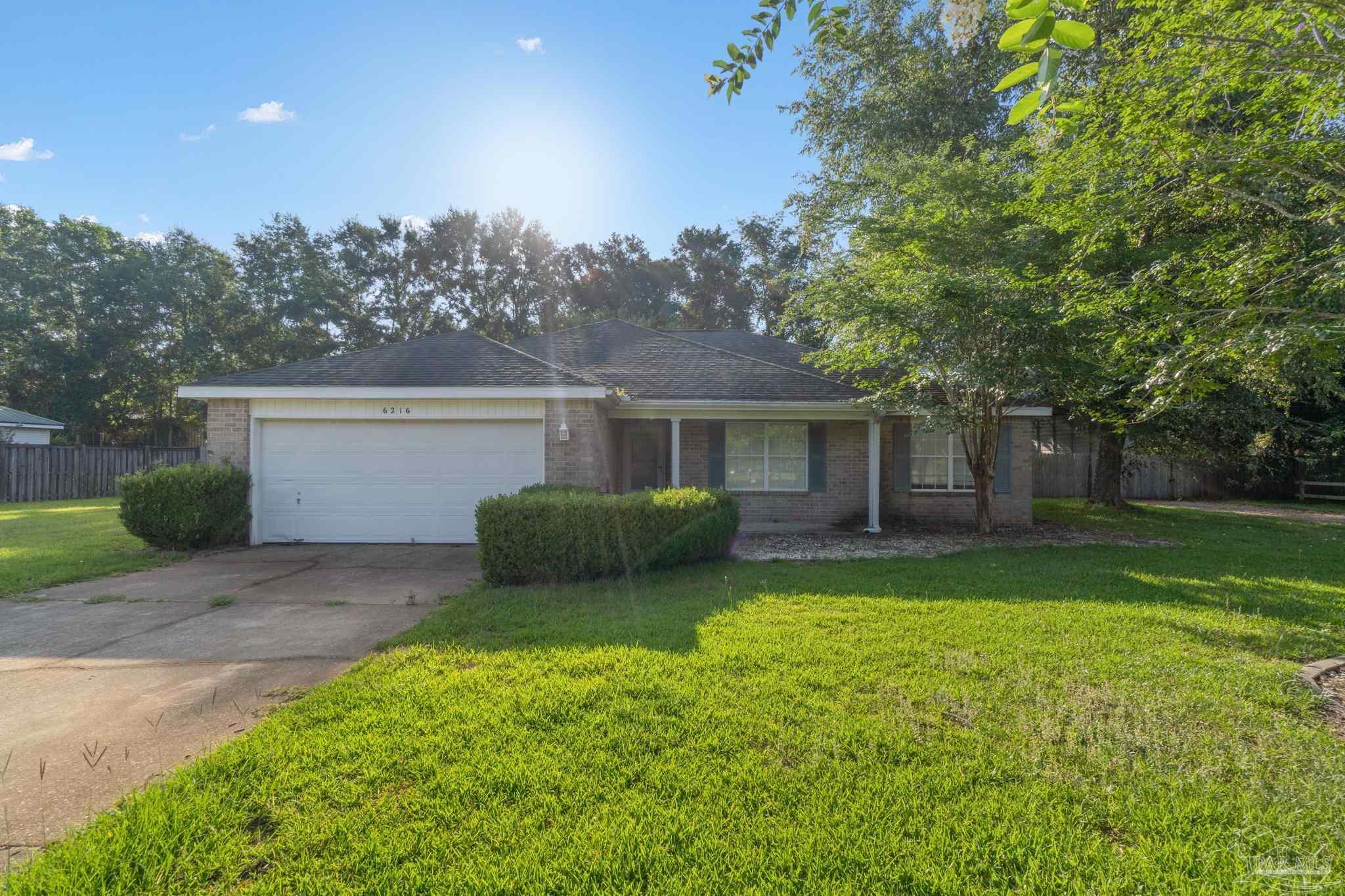 6216 Billoree Road Milton, FL 32571 - Photo 1 of 50 a view of a house with a yard and a large tree