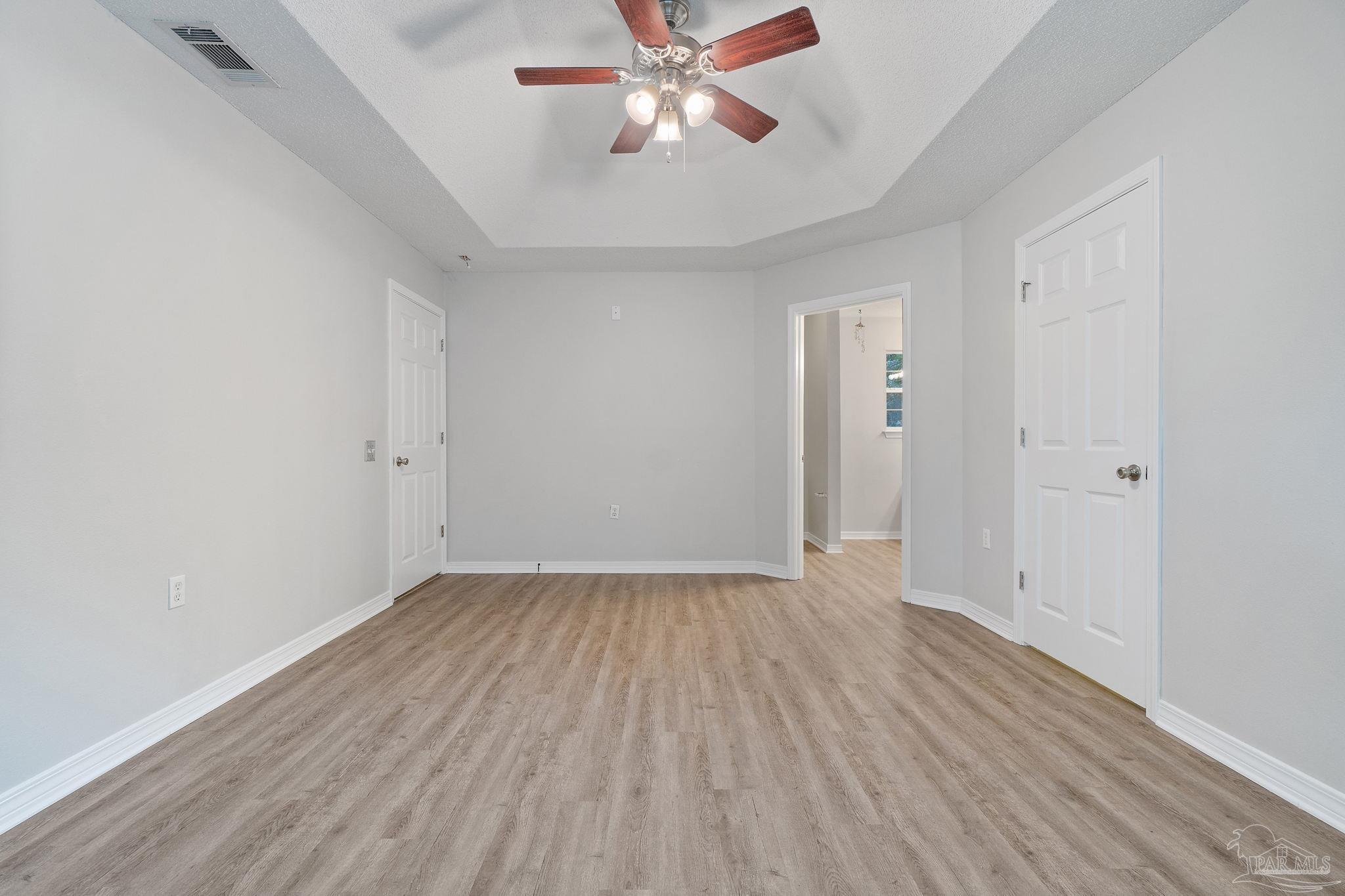 6216 Billoree Road Milton, FL 32571 - Photo 14 of 50 wooden floor in an empty room with a fan