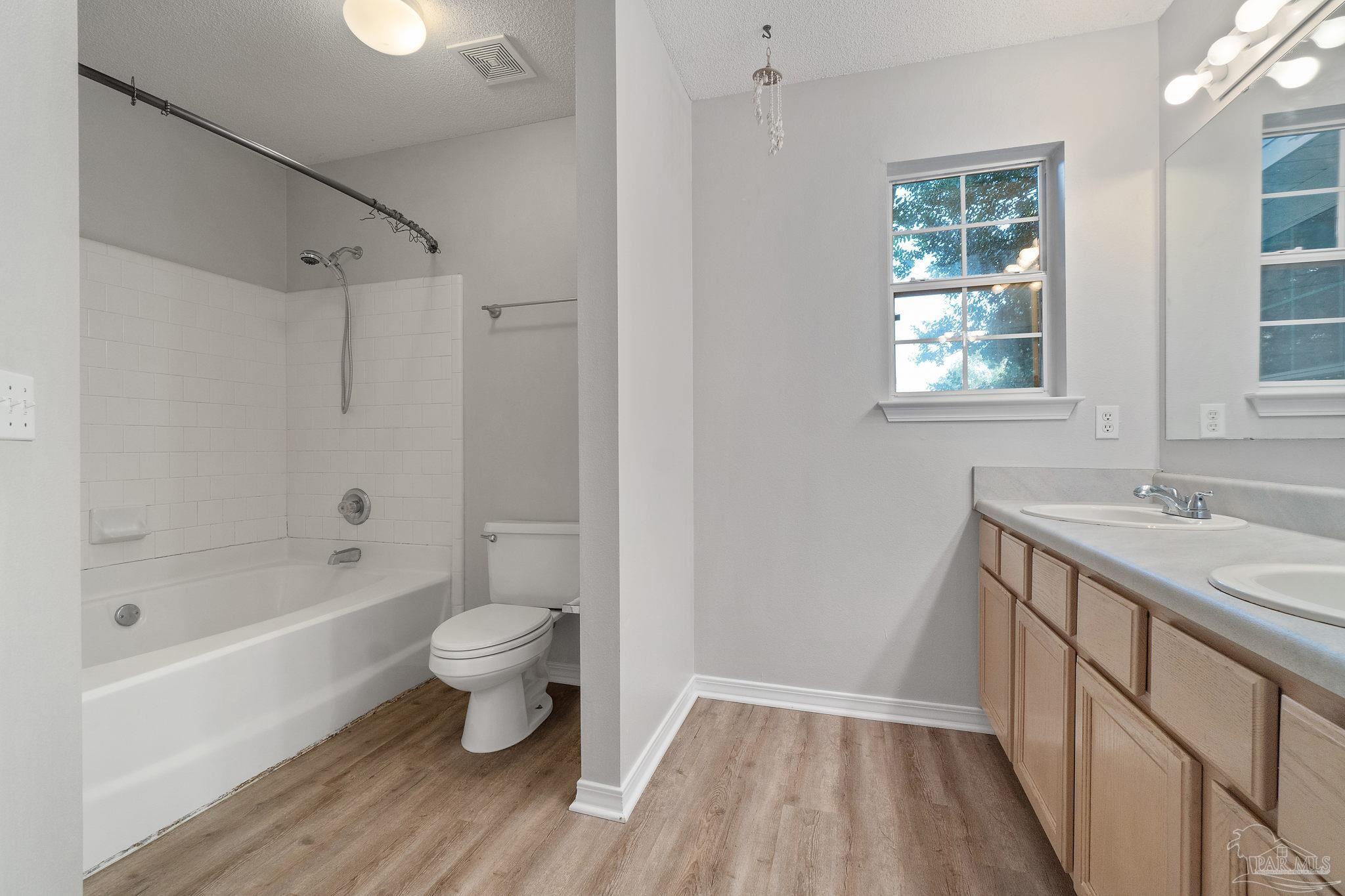 6216 Billoree Road Milton, FL 32571 - Photo 19 of 50 a bathroom with a sink a toilet and a bathtub