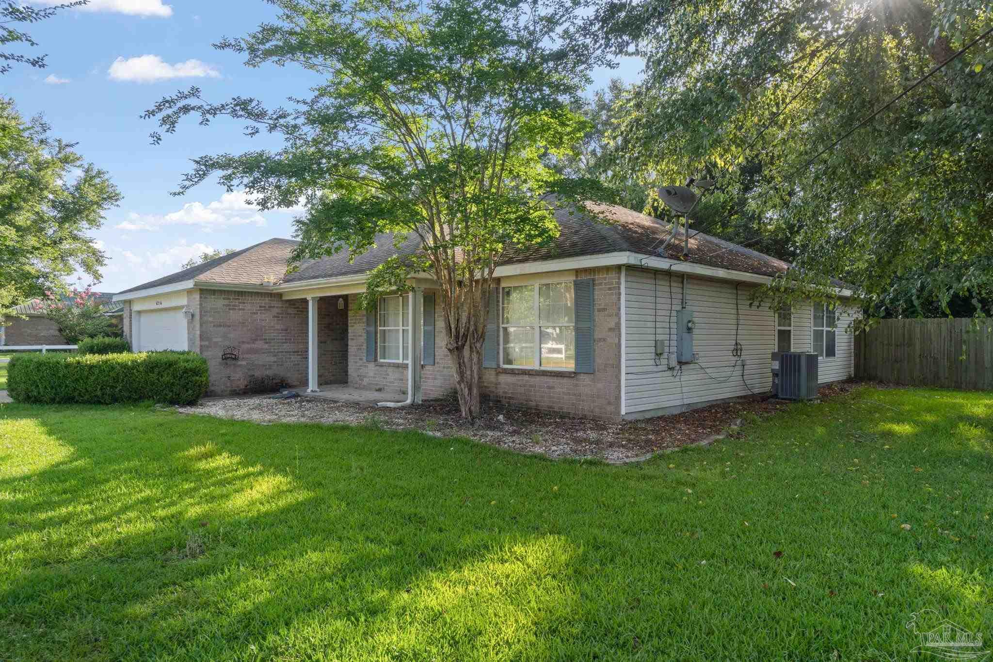 6216 Billoree Road Milton, FL 32571 - Photo 3 of 50 a view of a house with a yard and large tree