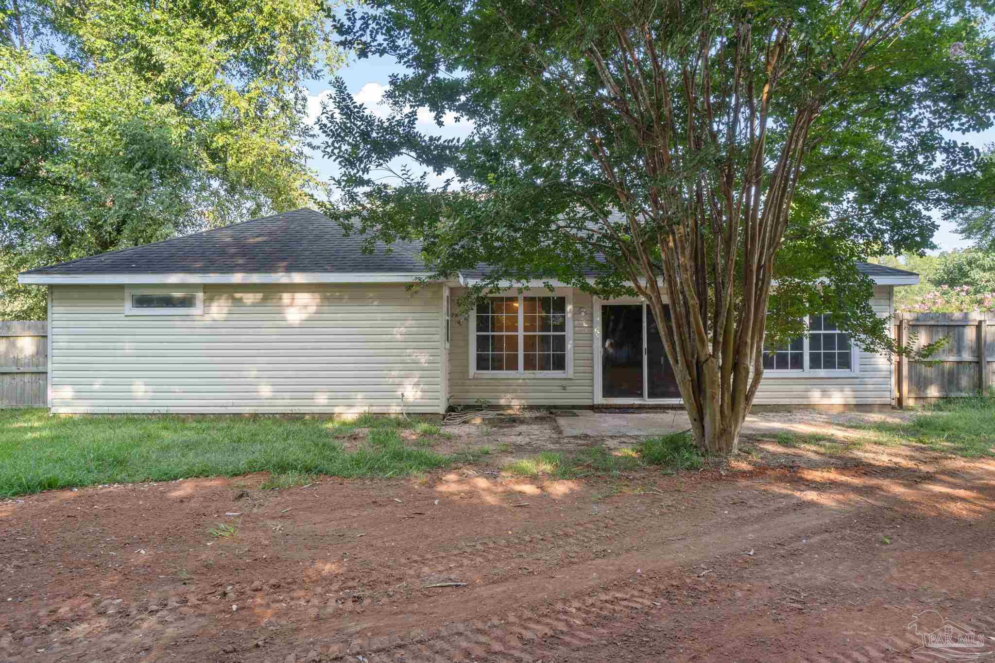 6216 Billoree Road Milton, FL 32571 - Photo 39 of 50 a front view of a house with garden