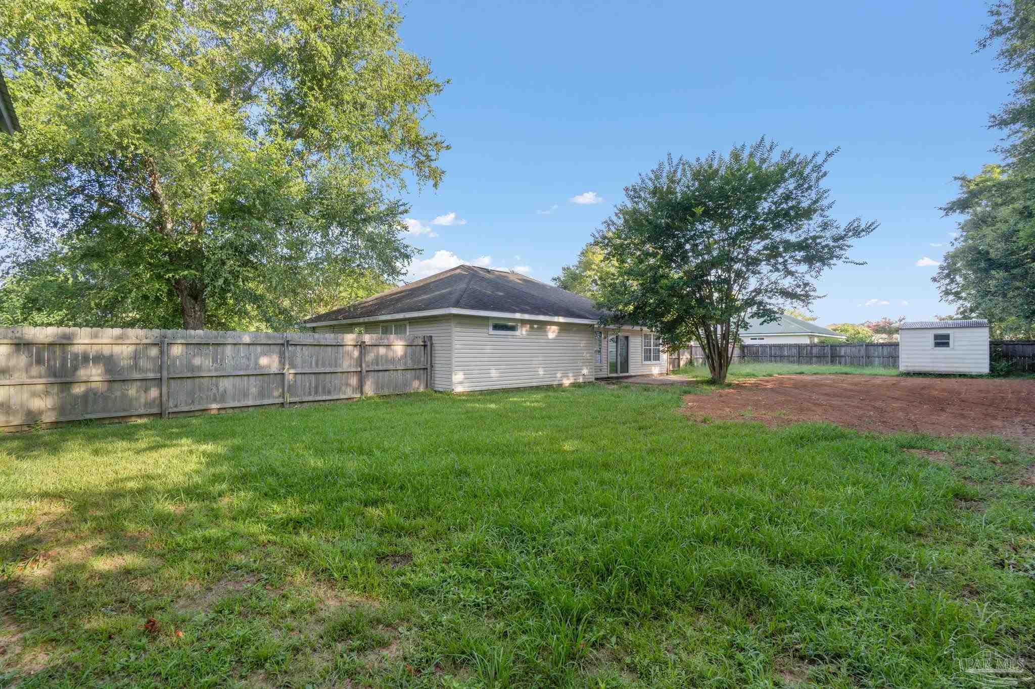 6216 Billoree Road Milton, FL 32571 - Photo 40 of 50 a view of a house with a yard