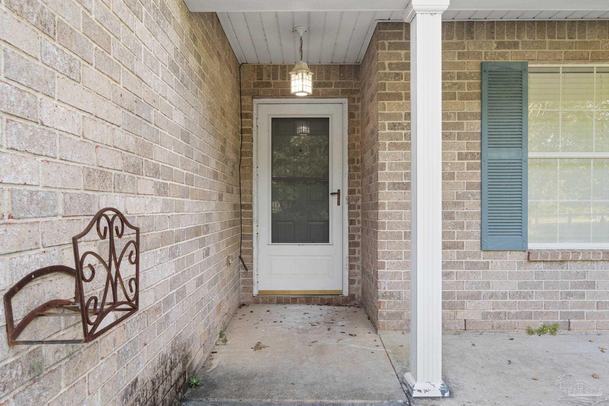 6216 Billoree Road Milton, FL 32571 - Photo 4 of 50 a front view of a building with entryway