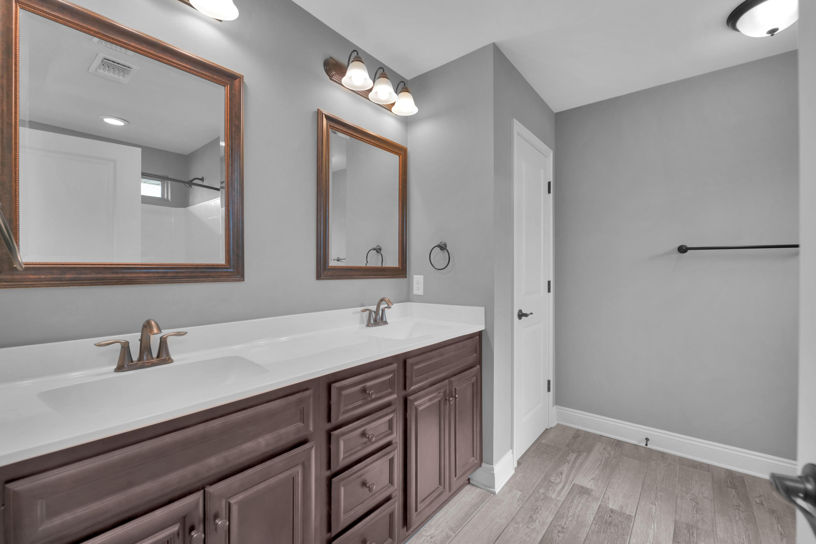 2047 Alhambra Street Navarre, FL 32566 - Photo 13 of 24 a bathroom with a double vanity sink and mirror