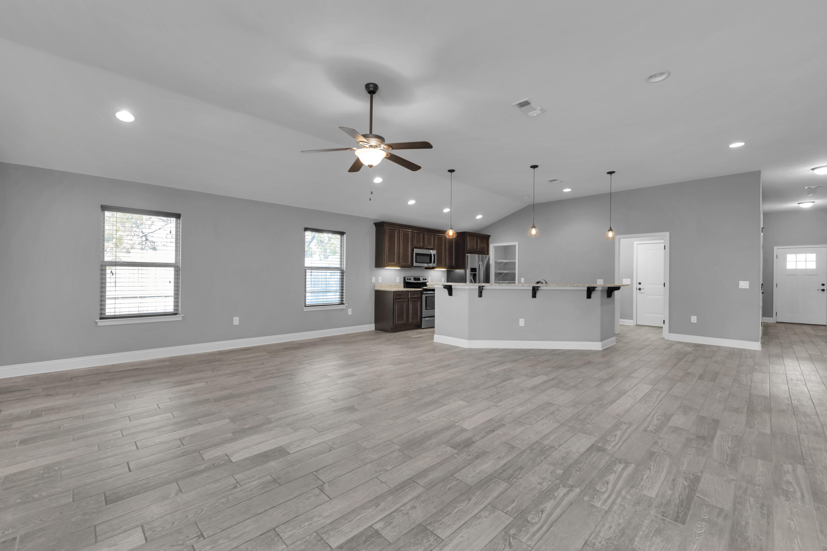 2047 Alhambra Street Navarre, FL 32566 - Photo 10 of 24 a view of a kitchen with a sink and a microwave