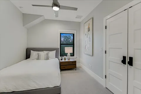 a bedroom with a bed and a walk in closet