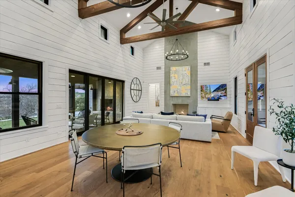a living room with fireplace furniture and a wooden floor