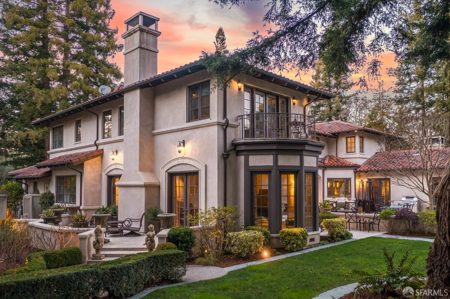 75 Almendral Avenue Atherton, CA 94027 - Photo 11 of 40 a front view of a house with a yard table and chairs