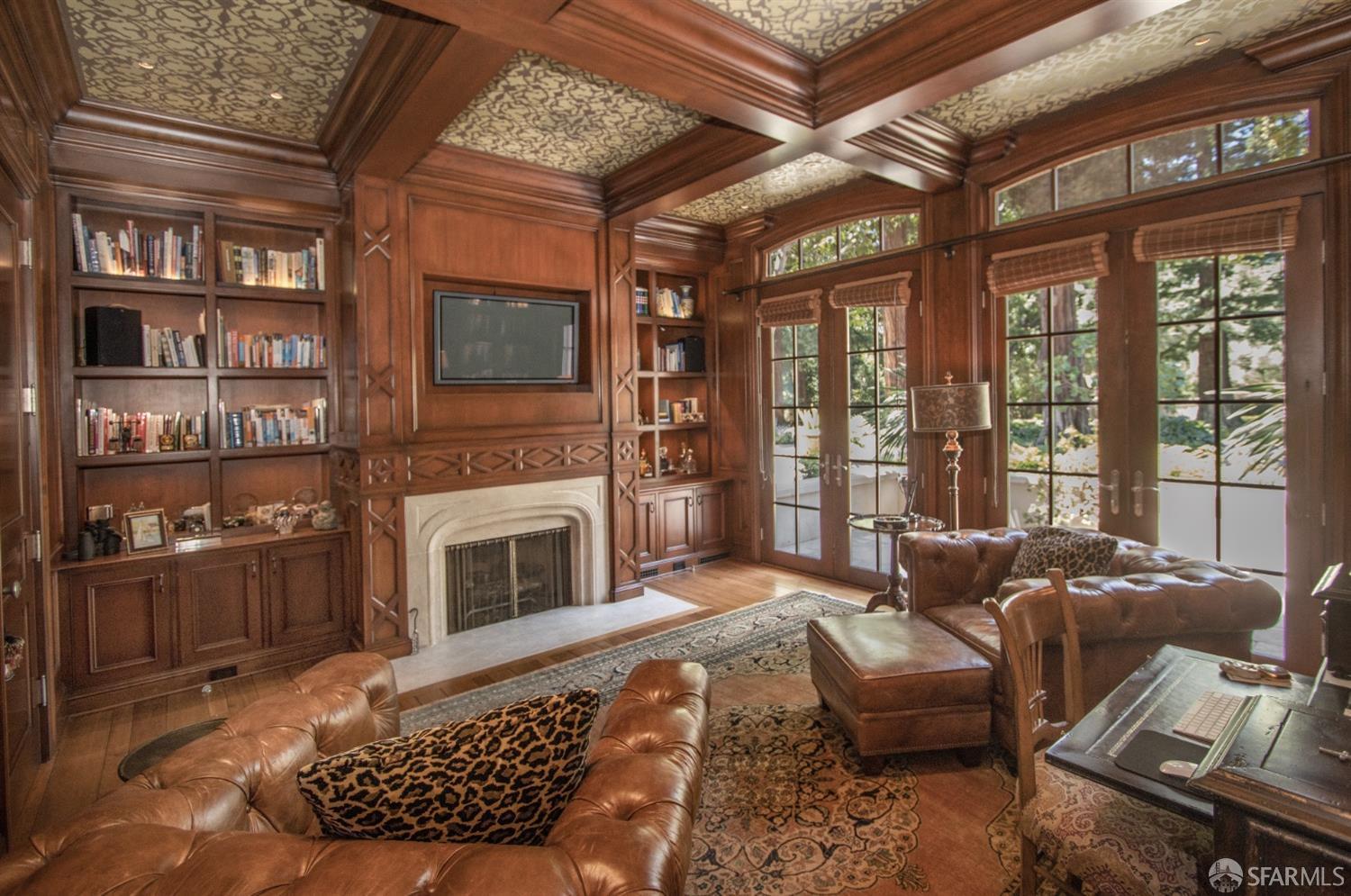 75 Almendral Avenue Atherton, CA 94027 - Photo 21 of 40 a living room with furniture a fireplace and a flat screen tv